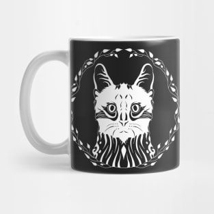 frontal cat face in a wreath Mug